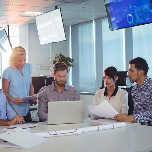 Four colleagues at a regional headquarters office in Costa Rica