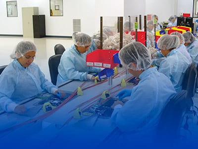 Technicians on a medical device assembly line in Costa Rica